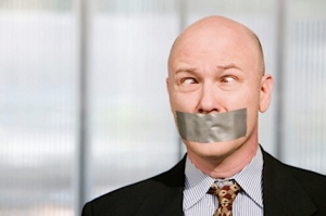 duct tape over businessman's mouth